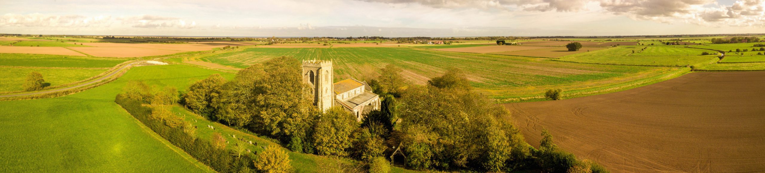 Aerial view of a church in surrounded by countryside